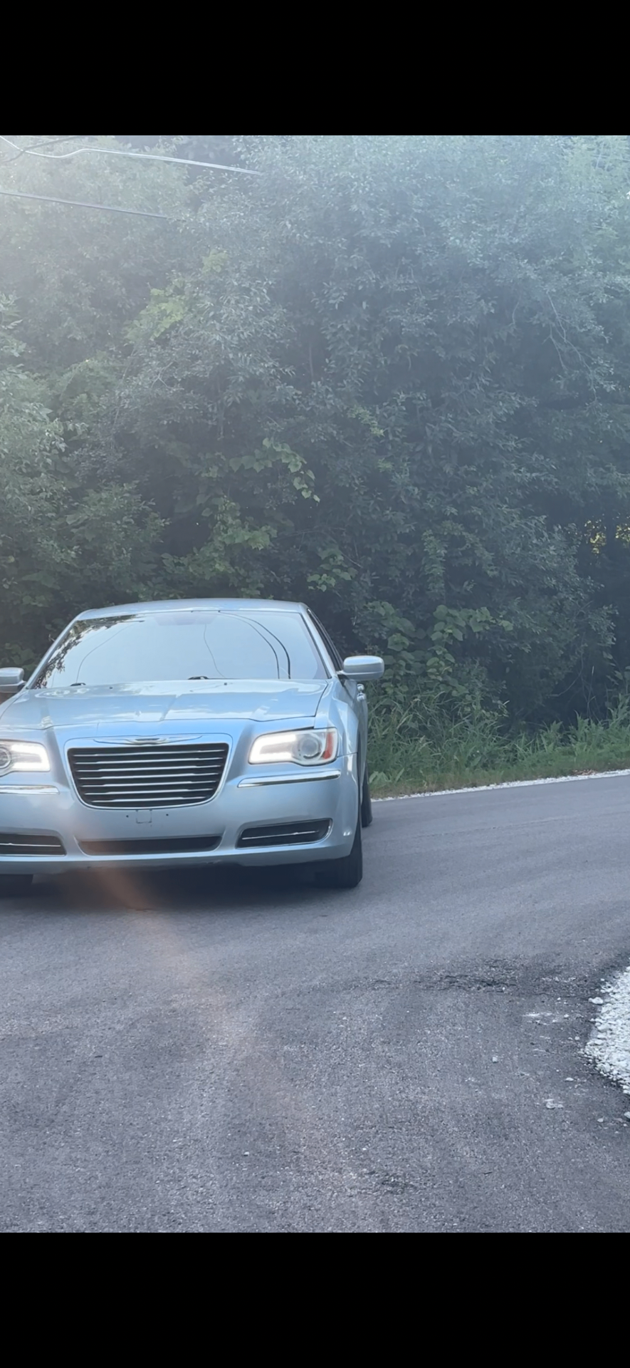 Freshly detailed luxury car with gold rim lighting